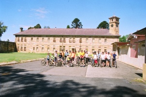 Cheerful cyclists outside the Mens Ward of Old Cumberland Hospital.